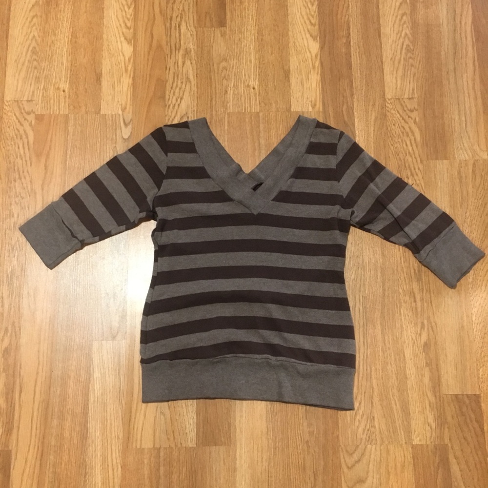 Two toned striped V-neck sweater.